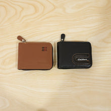 Live shot of man holding zip-around card holder wallet showing texture