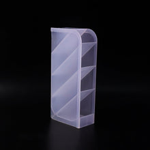 Close-up of plastic multi-storage holder compartments