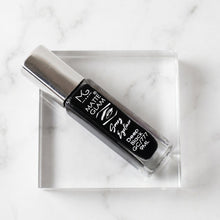 Precision applicator brush of deep black matte eyeliner for fine or bold strokes
