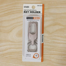 Metal keychain displayed with size reference