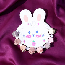 Close-up view of colorful mini hair claw clips designed for kids