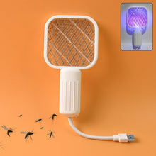 A white electric bug zapper with a square head and ribbed handle, connected to a USB cable, with mosquitoes flying around