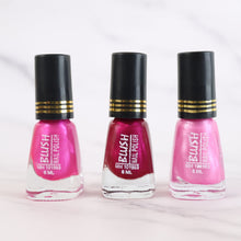 Metallic nail colour in dark mini nail polish bottle with glitter effect