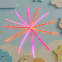 Kids playing with neon glow stick toy set