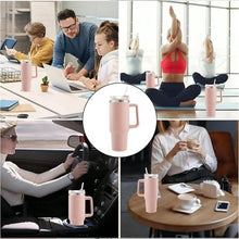Pink vacuum insulated tumbler on white background