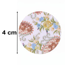 A round pop socket with a white background and colorful paisley floral pattern, with a 4 cm measurement arrow on the left.