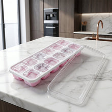 Side view of pink ice cube tray with lid