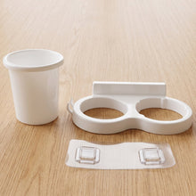 Durable plastic toothbrush holder for wall mounting in bathrooms