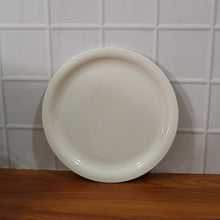 Lightweight and sturdy round serving plate for diverse kitchen needs