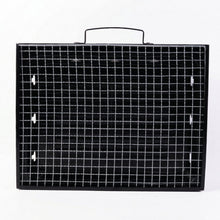 Portable charcoal grill with steel mesh surface