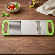 The versatile kitchen tool depicted making uniform french fry cuts from a potato.