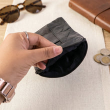 Interior view of the compact leather coin and card pouch.