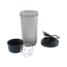 A disassembled grey and black shaker bottle with a metal whisk is arranged on a white background.