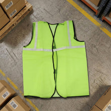 Close-up of the durable polyester fabric and reflective strips on the safety jacket.
