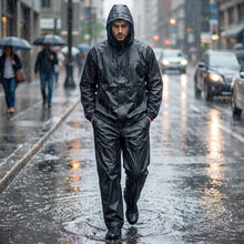 Model wearing a black waterproof rain coat set for men and women.