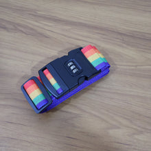 Rainbow Luggage Strap securing a black suitcase, making it easy to spot.