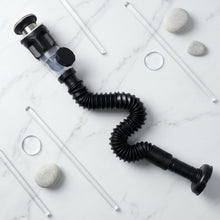 Close-up shot of flexible sink drain pipe being installed in bathroom
