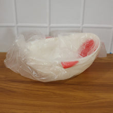 Empty fish-shaped rice drainer, ready for washing grains or produce.