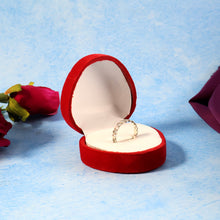 White packaging box enclosing the heart-shaped velvet ring box for gifting