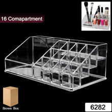 Close-up of clear acrylic compartments holding cosmetic products