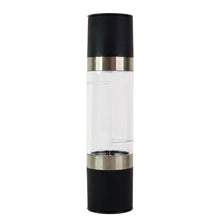 Clear acrylic chamber displaying salt and peppercorns inside grinder