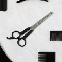 Hair thinning scissors showing detailed micro-toothed blade for bulk reduction
