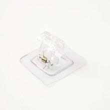 Self-adhesive curtain rail clip installed on wall for lightweight curtains