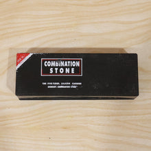Black cardboard box with red and white text for 