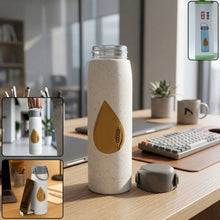 Stylish glass water bottle with phone holder for desk or travel