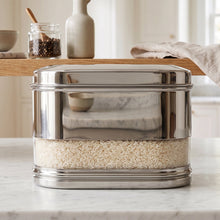 Side view of stainless steel modular oval canister in kitchen
