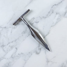 Stainless steel coconut breaker tool set displayed on a white background