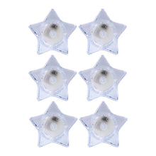 Battery operated LED candles in star-shaped holders for safe lighting