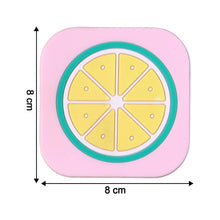 Bright yellow lemon silicone drink coaster displayed on coffee table