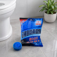 A blue package of toilet cleaner tablets with Chinese text sits on a tiled floor next to a single blue tablet.