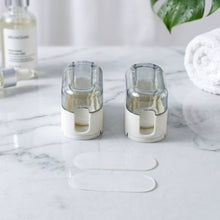 Toothbrush holder mounted on a bathroom wall