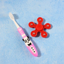 Close up of fidget spinner toy included in kids toothbrush set