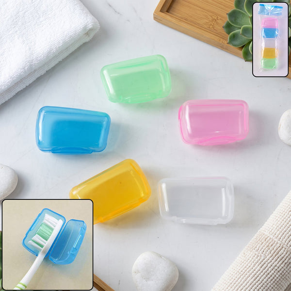 Five translucent plastic toothbrush head covers in blue, green, pink, yellow, and clear are scattered on a white marble