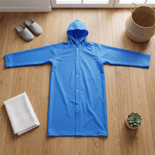 Blue raincoat button closure