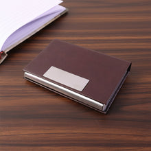 Business card holder closed with magnetic flap for secure storage