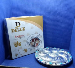 Detailed view of the durable plastic and silver-plated Rotating Dry Fruit Tray.