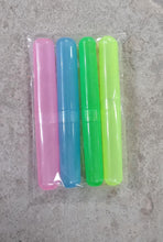 A hand holding a plastic toothbrush cover, demonstrating its portable size.