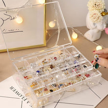 Top-down view of the open acrylic jewelry box revealing its spacious two-layer design.