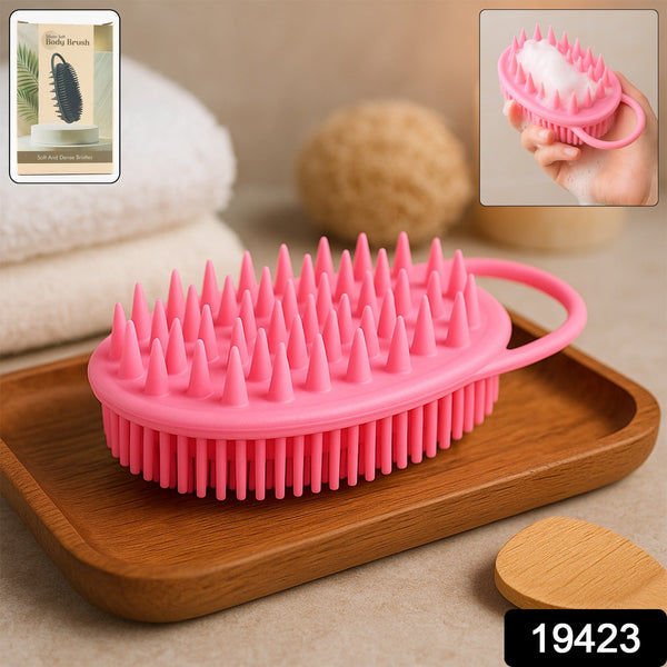 A pink silicone body brush with spiky bristles rests on a wooden tray, with an inset image showing it in use and a product