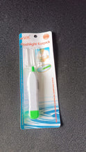 LED flashlight ear cleaner tool showing ergonomic grip