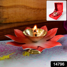 Close-up of lotus shaped brass oil diya showing polished brass bowl