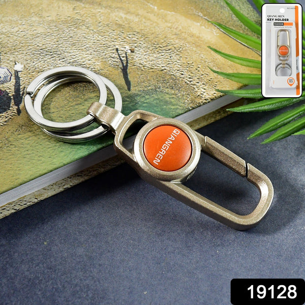 Close-up of metal keychain carabiner clip with dual key rings on a white background