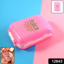 Open pink pill box showing dual-sided compartments for pills