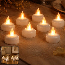 Eight white LED tealight candles with warm yellow flickering flames, arranged on a beige textured surface.