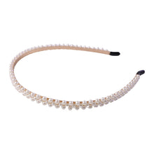 Elegant white pearl hairband, angled view showing details