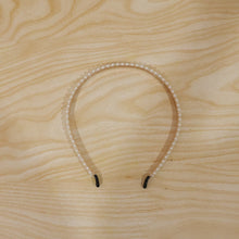 Pearl hairband featuring delicate white beads for a chic look